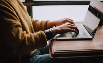 person typing on computer